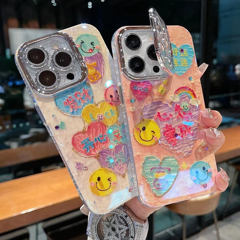 适用苹果系列iPhone16新款手机壳时尚笑脸文字银灰色闪粉镜头支架