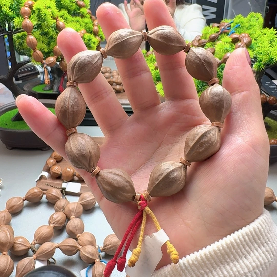 e***n橄榄核手串三面佛