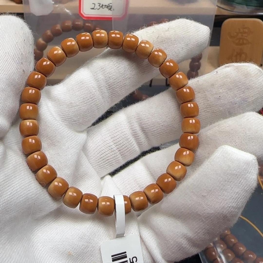 橄榄核手串老挝单圈极限弧微色差7.0mm