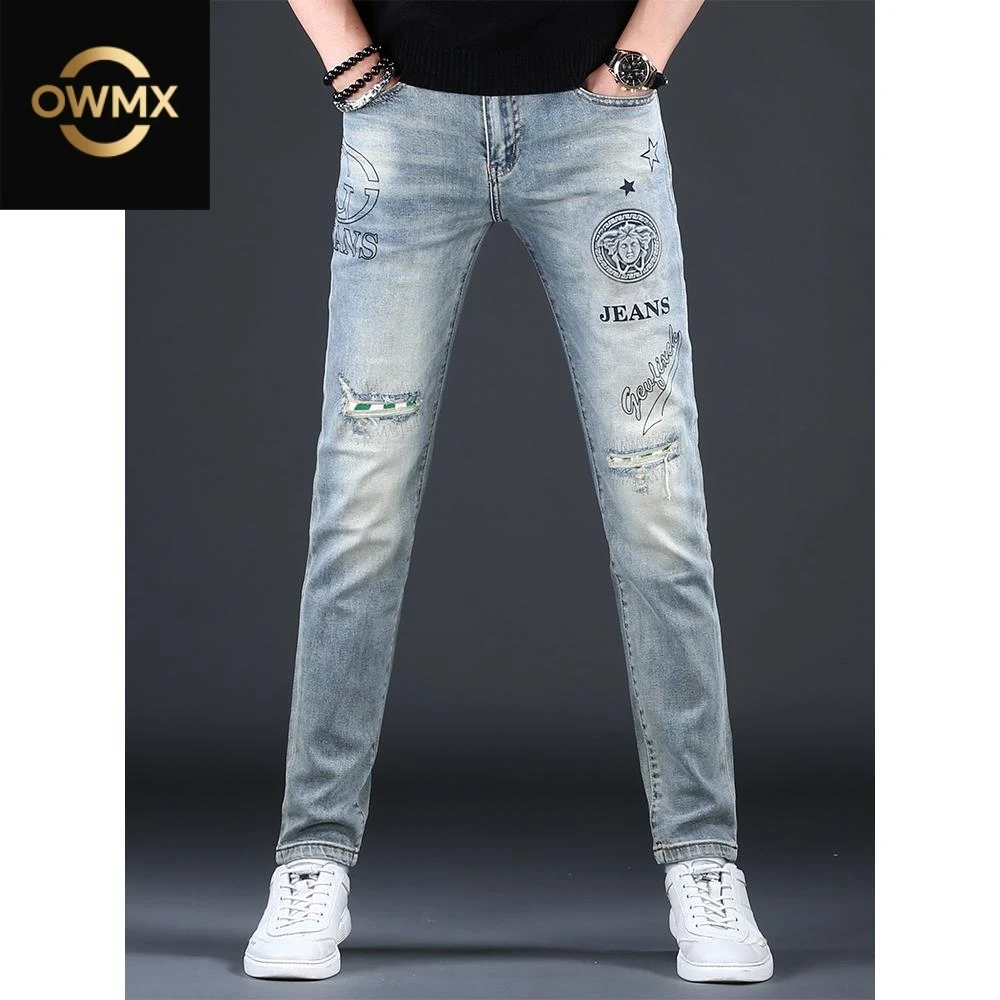 高端潮牌浅蓝色破洞牛仔裤男款春夏季新款修身小脚显瘦男士长裤子