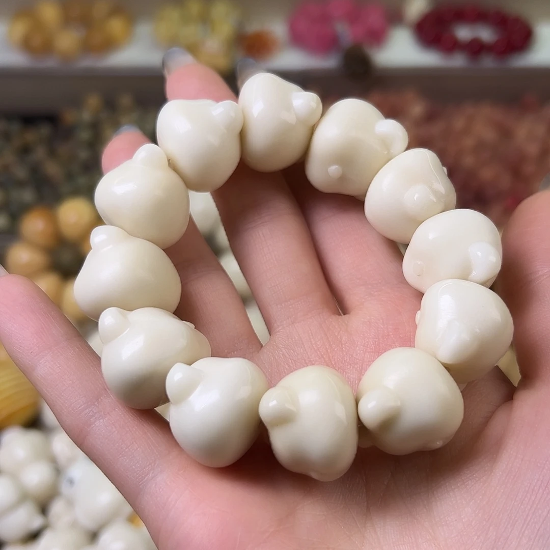 菩提根/象牙果吊坠微瑕熊头手串一条