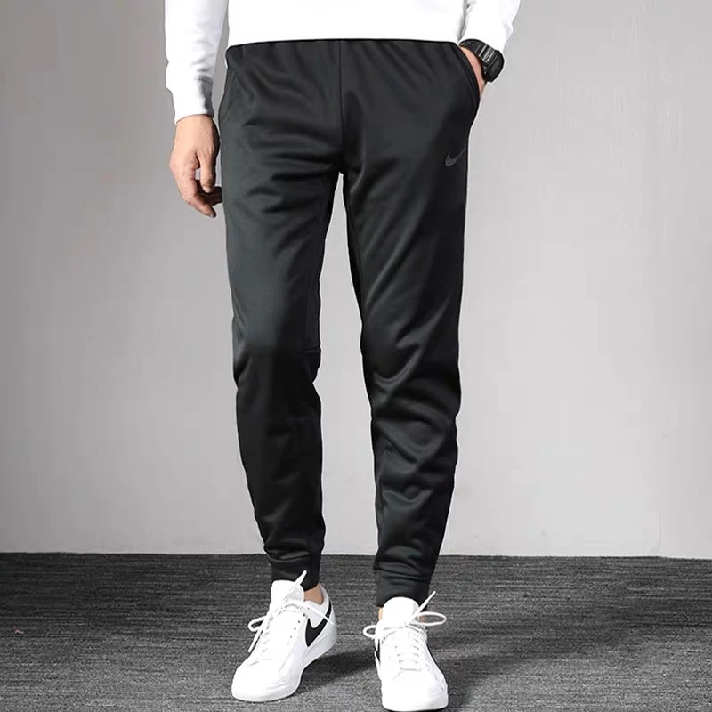 NIKE/耐克梭织运动裤加绒束脚裤防风保暖卫裤男裤休闲长裤932255