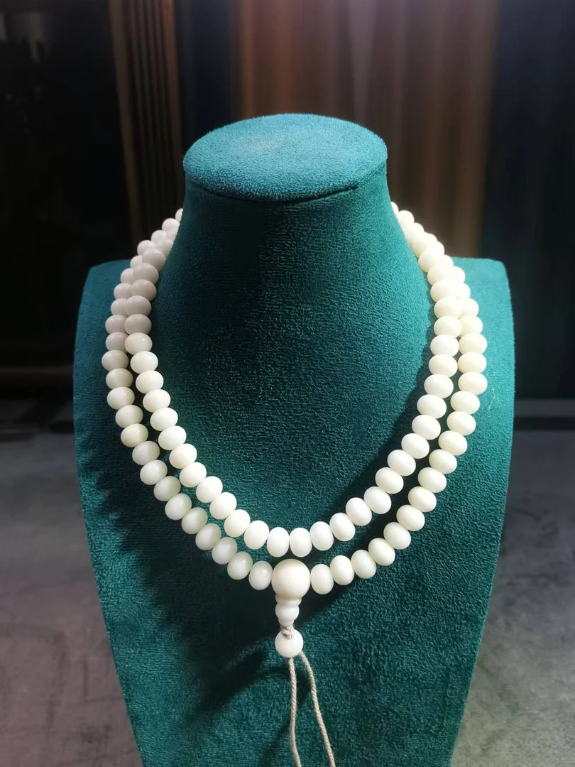 B336白玉菩提根卡0.9算盘珠108