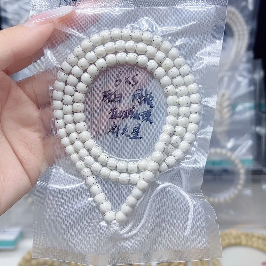 星月菩提手串原白6*5直切鼓珠半壁针尖星