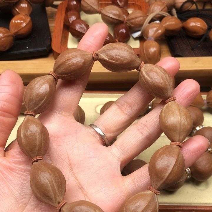 苟***.橄榄核手串梅林铁核17 X27三通去霜不退不换