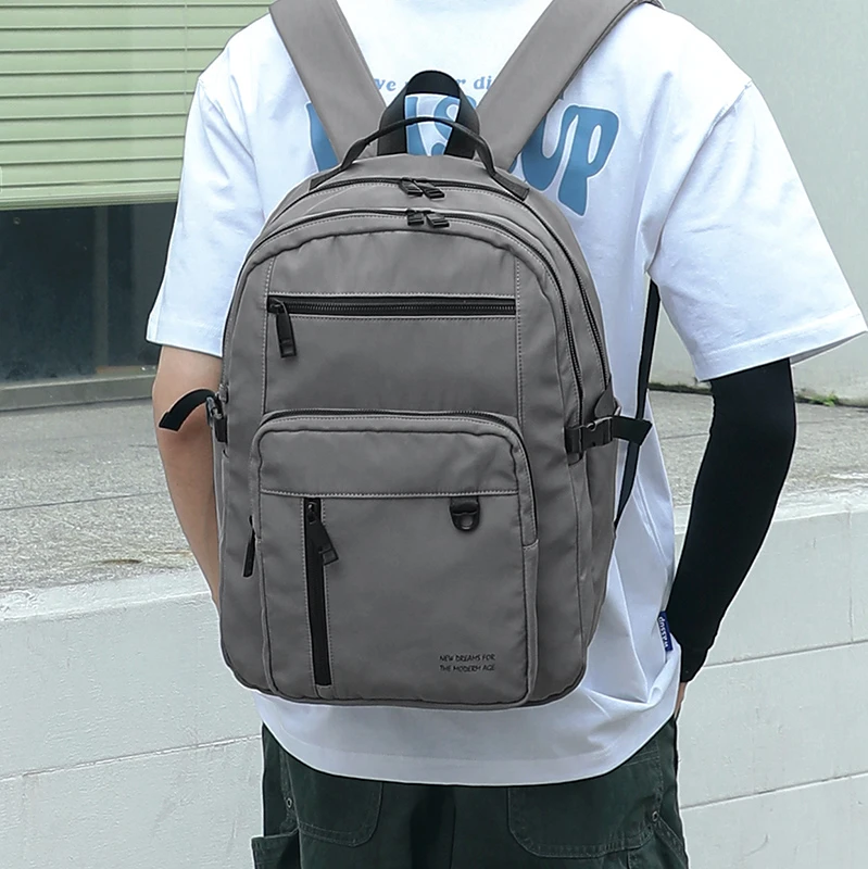 男士户外防水大容量双肩包简约双肩背多口袋轻便登山骑行运动背包
