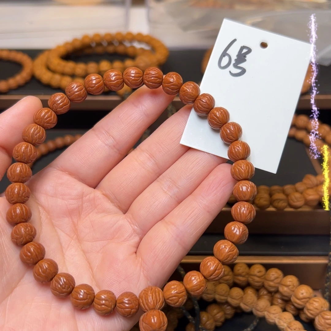 眉***店文玩核桃把件秦岭龙纹桃核9小奶豆手持