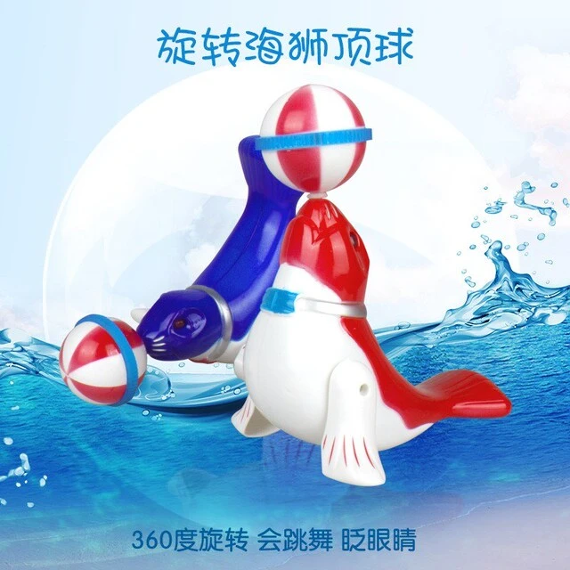 包邮大号海豚旋转电动儿童玩具眼睛闪光360度旋转海狮顶球礼品