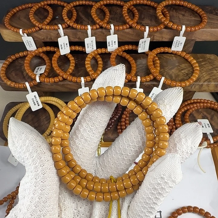 给***口手串橄榄核6.0mm 老挝核长串全品