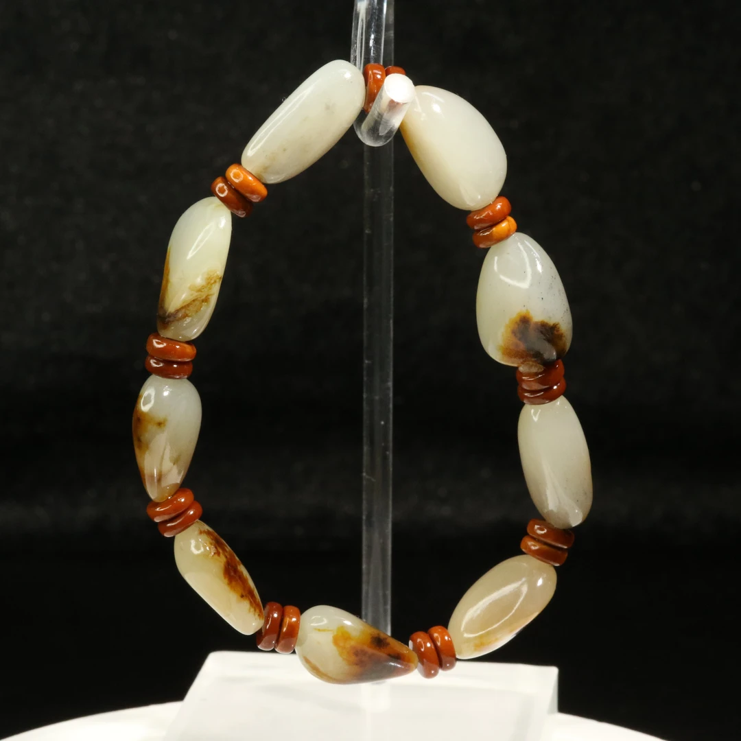 29和田玉聚红皮原石手串/900622保利厦门拍卖