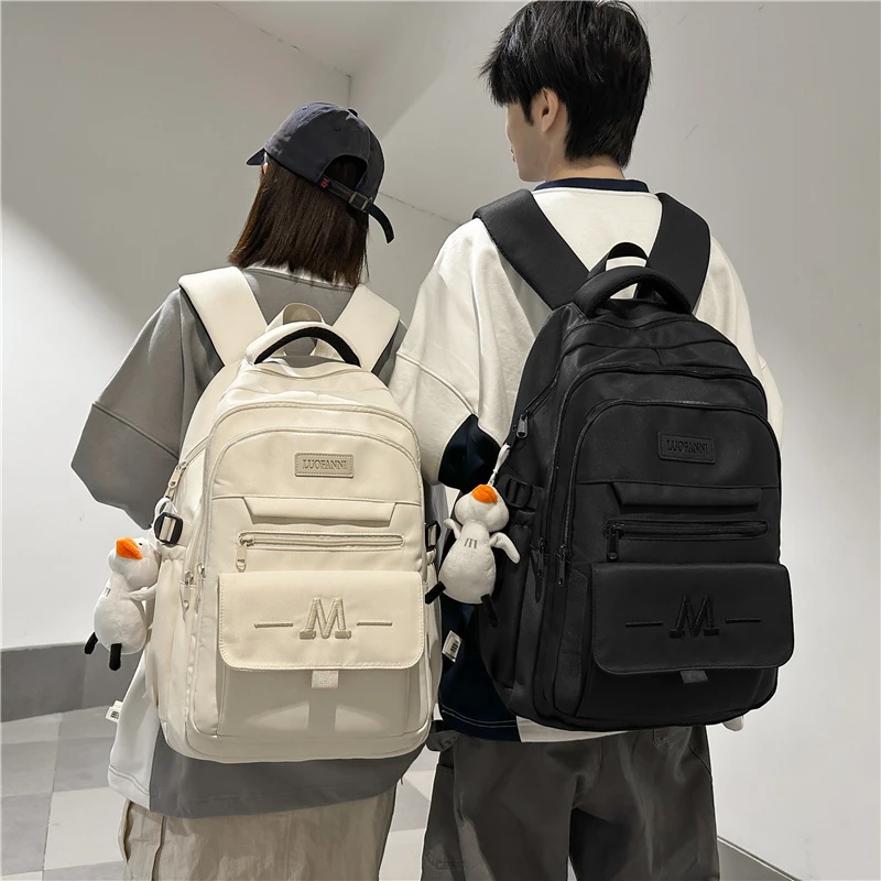 日系简约书包女大学生大容量纯色百搭休闲旅游双肩包中学生背包男