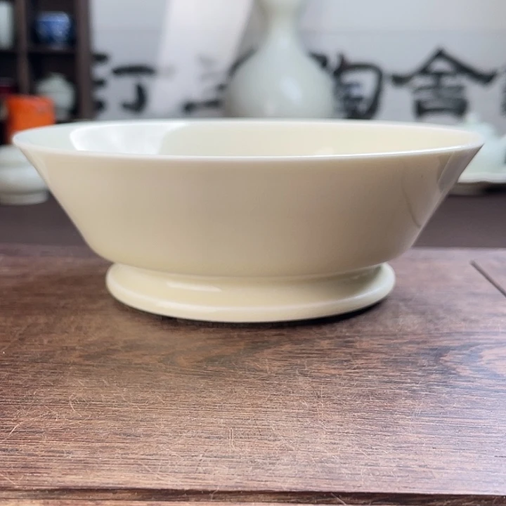 定窑白釉刻花兽纹洗