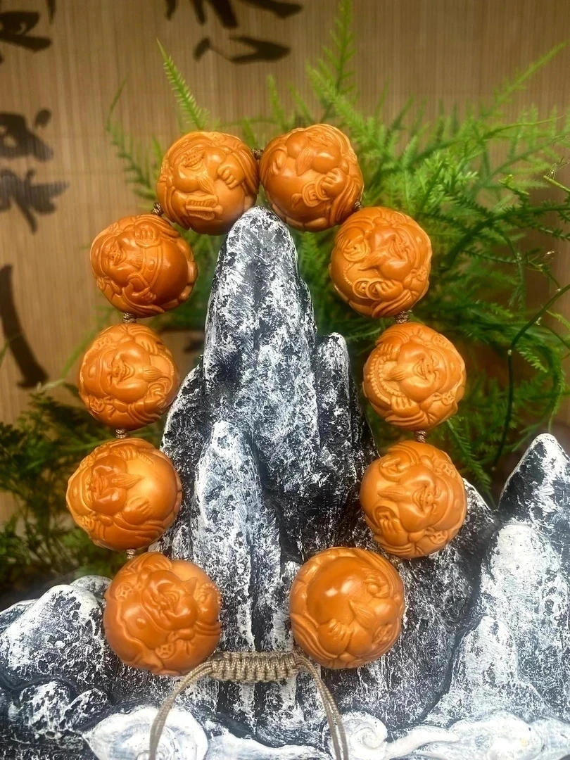 瑾雅，荷叶横财橄榄核雕手串2