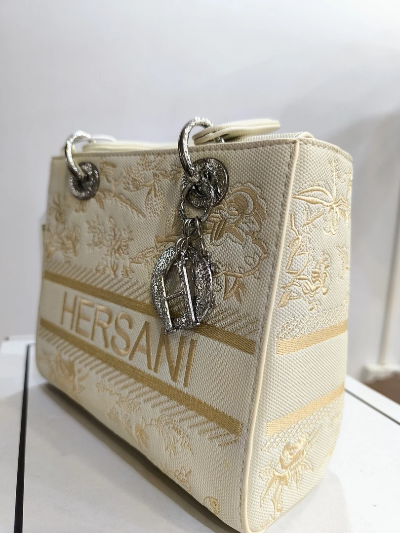 36刺绣通勤风手提款银色高档金色斜挎包桶包手工