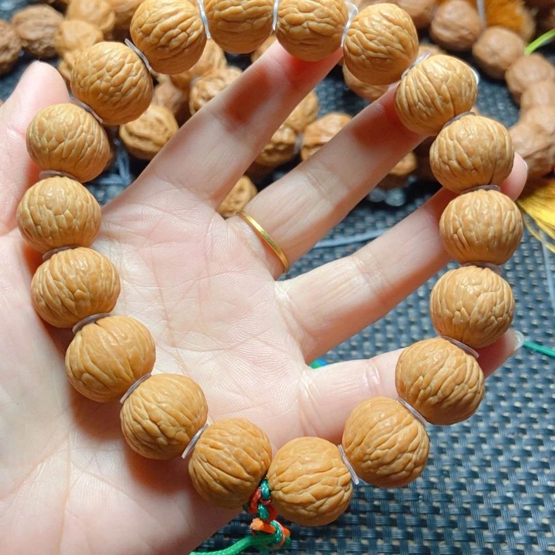 文玩核桃手串猴头凤羽