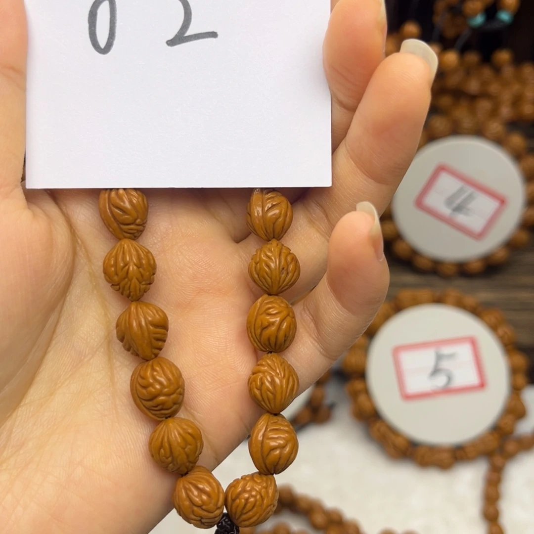 吊坠桃核于*成龙纹桃核手持小金豆10左右