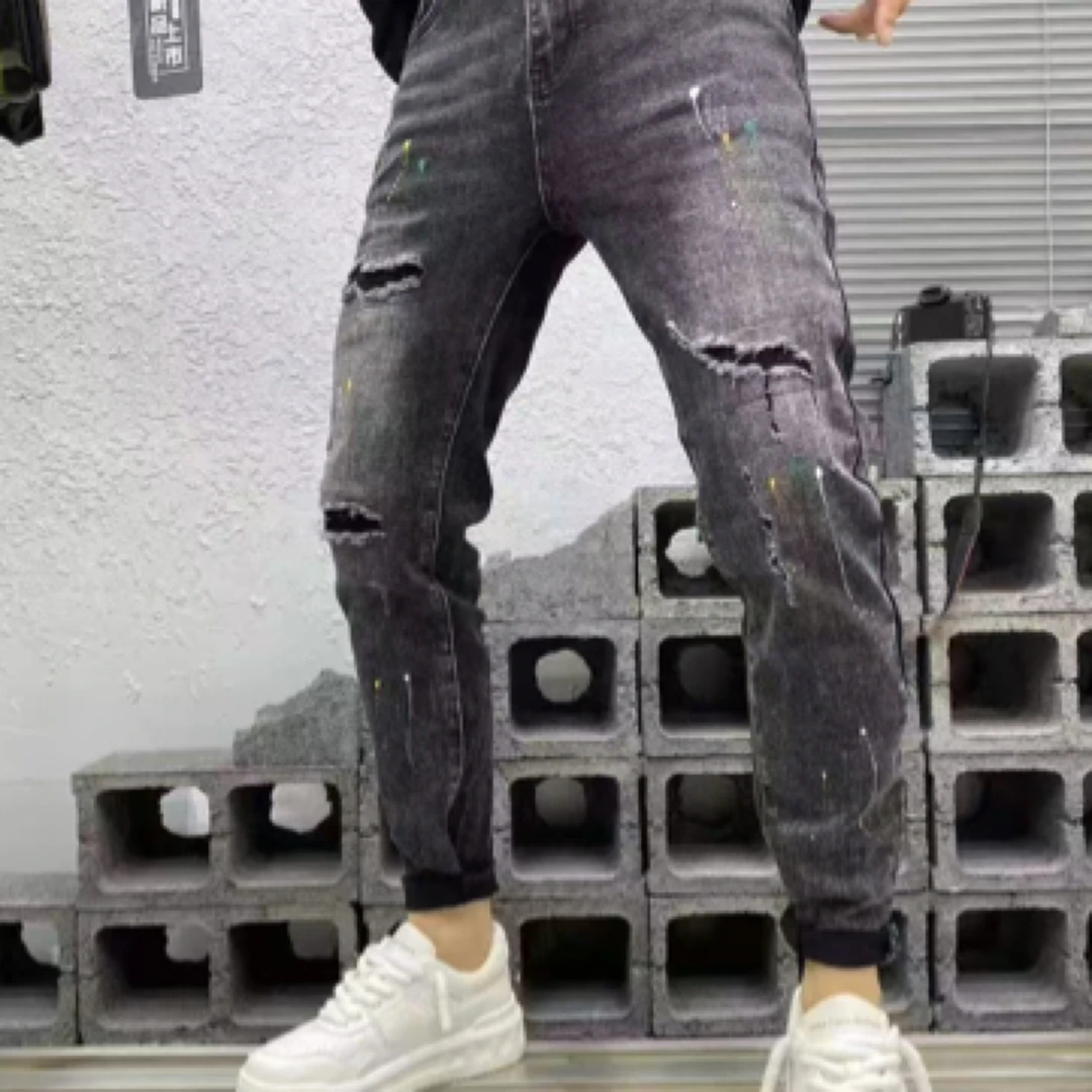 男士潮流破洞牛仔裤高级黑灰漆点个性设计修身小脚长裤
