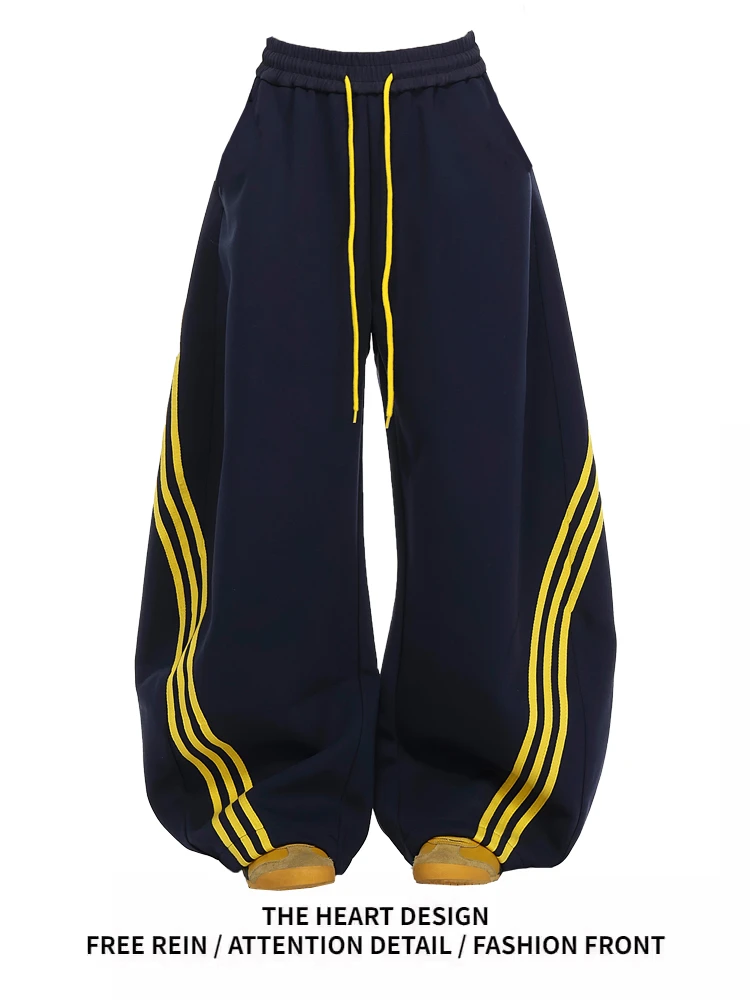 美式复古三条杠条纹撞色阔腿弯刀裤子女2025春设计感宽松运动卫裤