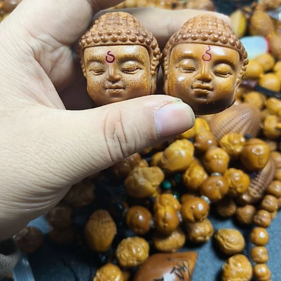 把件橄榄核佛头把件