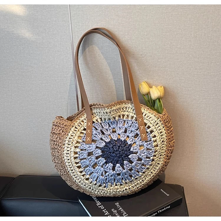 新款简约时尚夏季镂空圆形单肩草编包适合海边度假与日常通勤