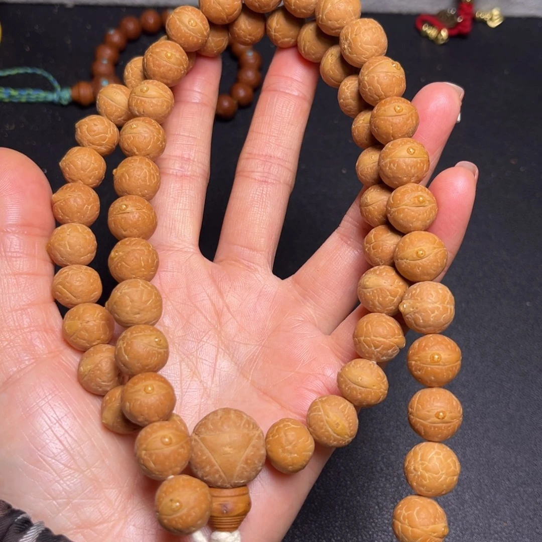 凤眼菩提吊坠12.5mm精品27颗手持