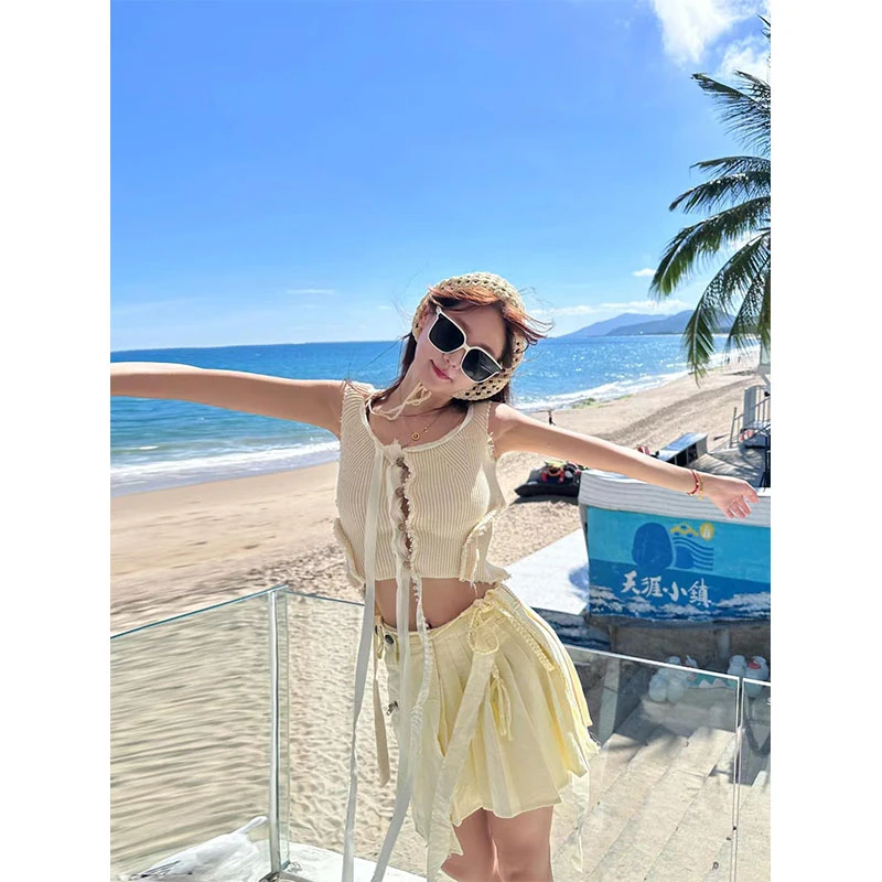 2025年夏季新款ins重工薄款毛边镂空针织开衫上衣配不对称百褶裙