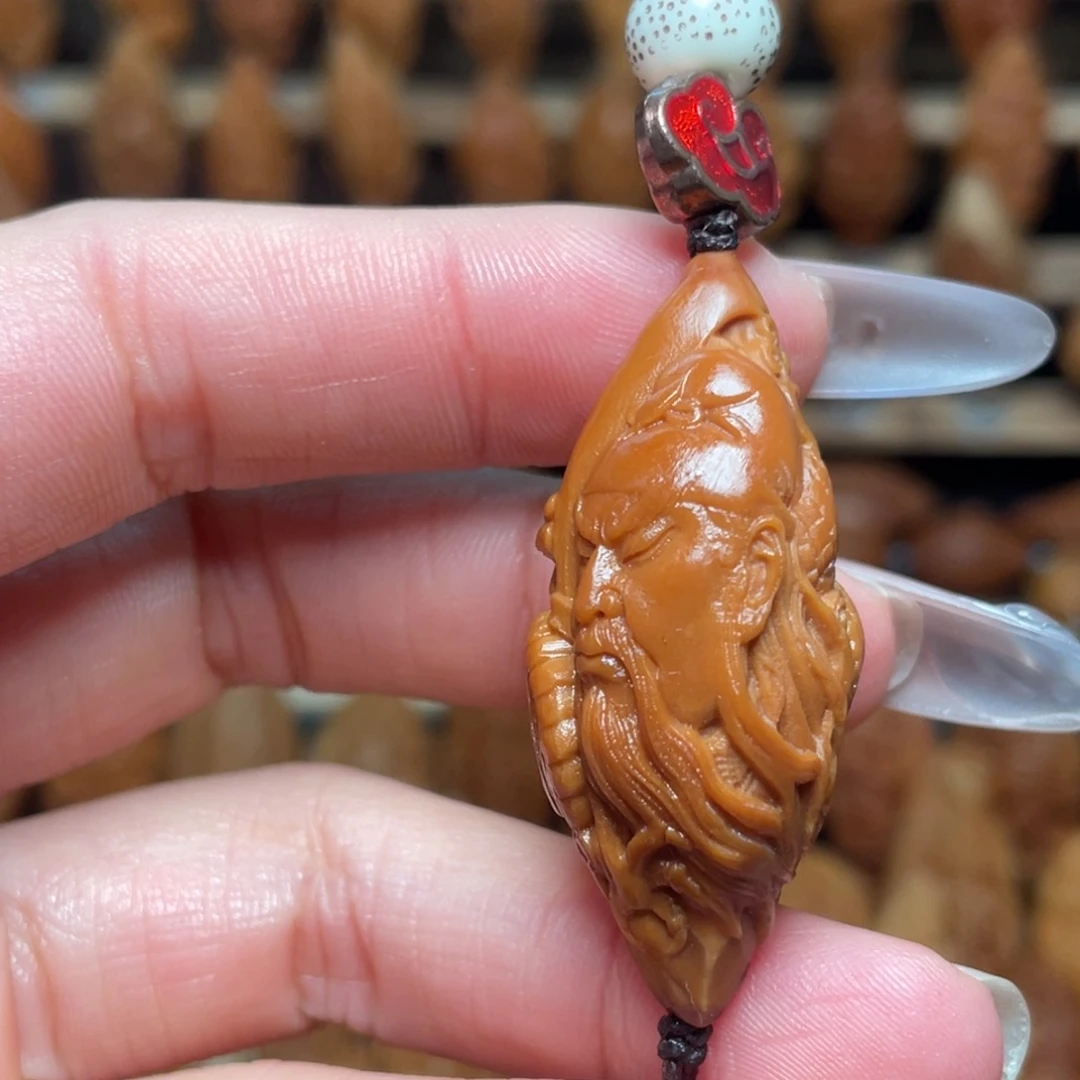 橄榄核把件关公头