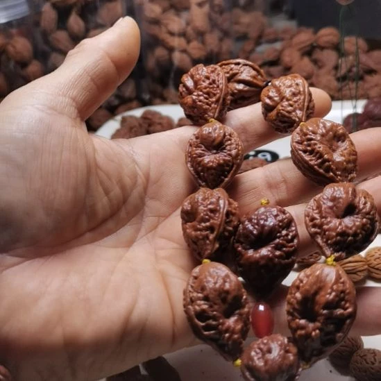 天***部文玩核桃吊坠东北楸异形籽20