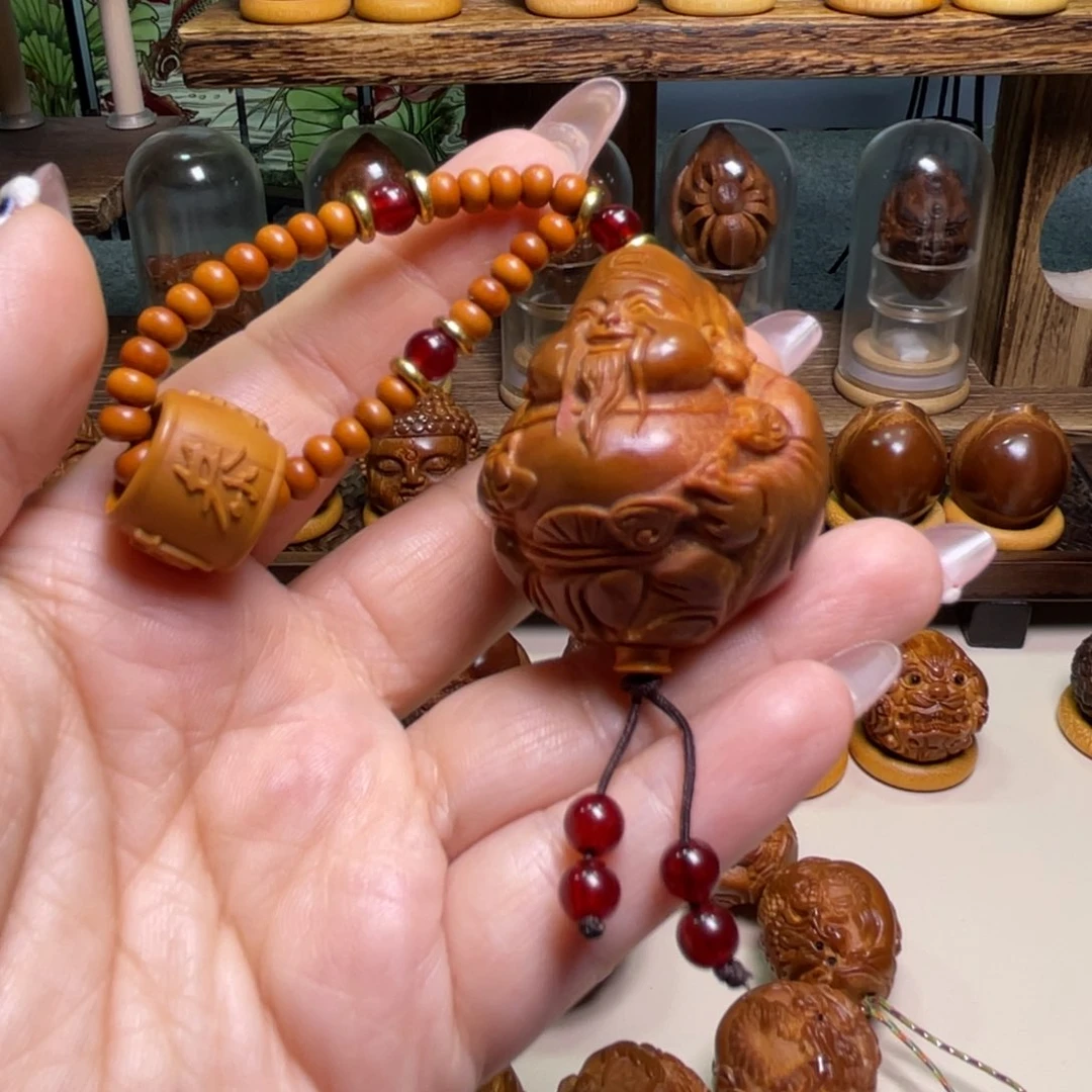 橄榄核吊坠捡漏财神手把