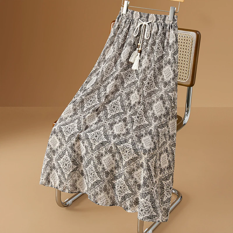 她池2025夏季新款女装民族风复古印花中长款A字半身裙T52X2481B