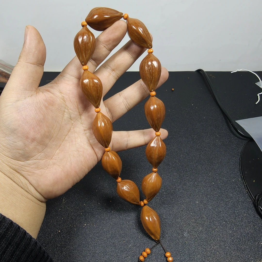 橄榄核打磨抛光大素核手持简单好盘易上色尺寸19x32左右文玩手持