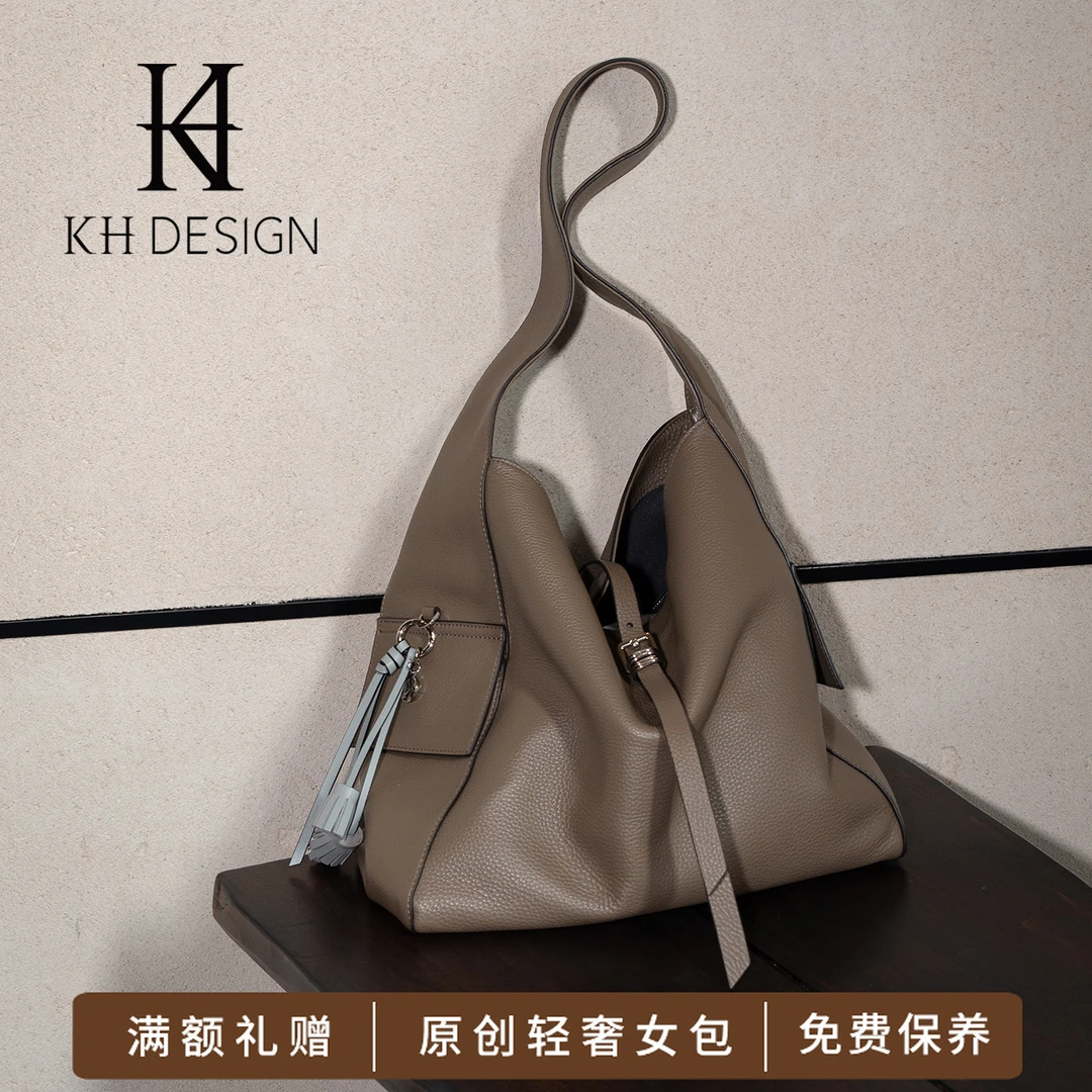 明治女包单肩包托特大容量女轻奢水桶包2025新款休闲挎包TMK1689