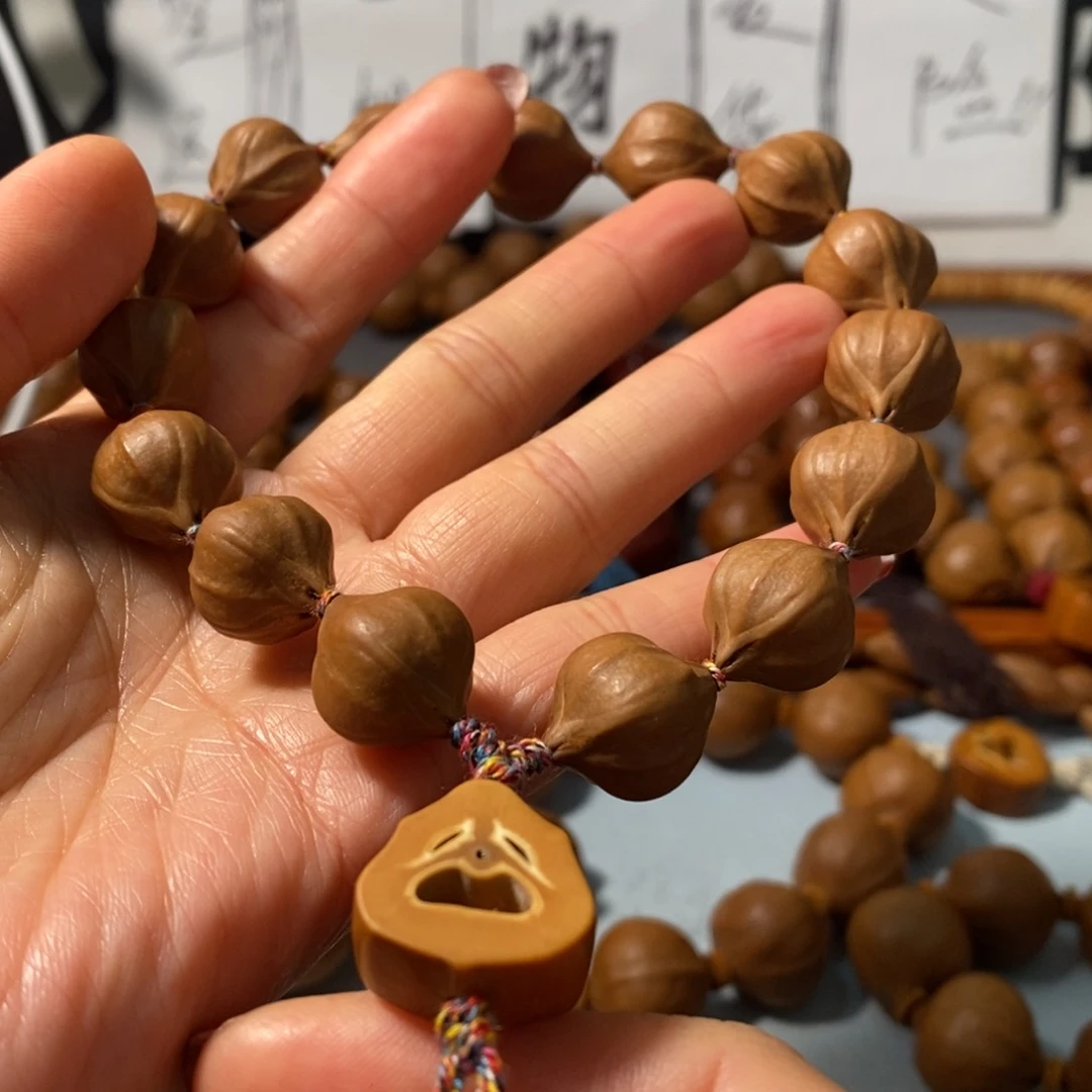 橄榄核手串刘****y7151精品4花老树小铁核15颗+鬼脸