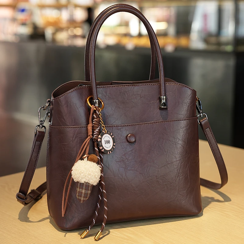 戈兰黛2025新款牛皮女包水桶包时尚百搭单肩包简约百搭女士手提包