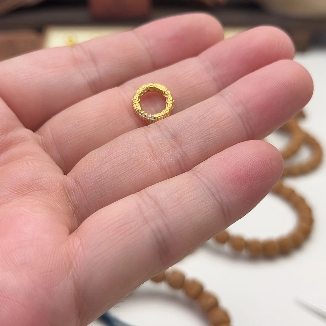 谷***｀吊坠猴头核桃卡环925银度k金