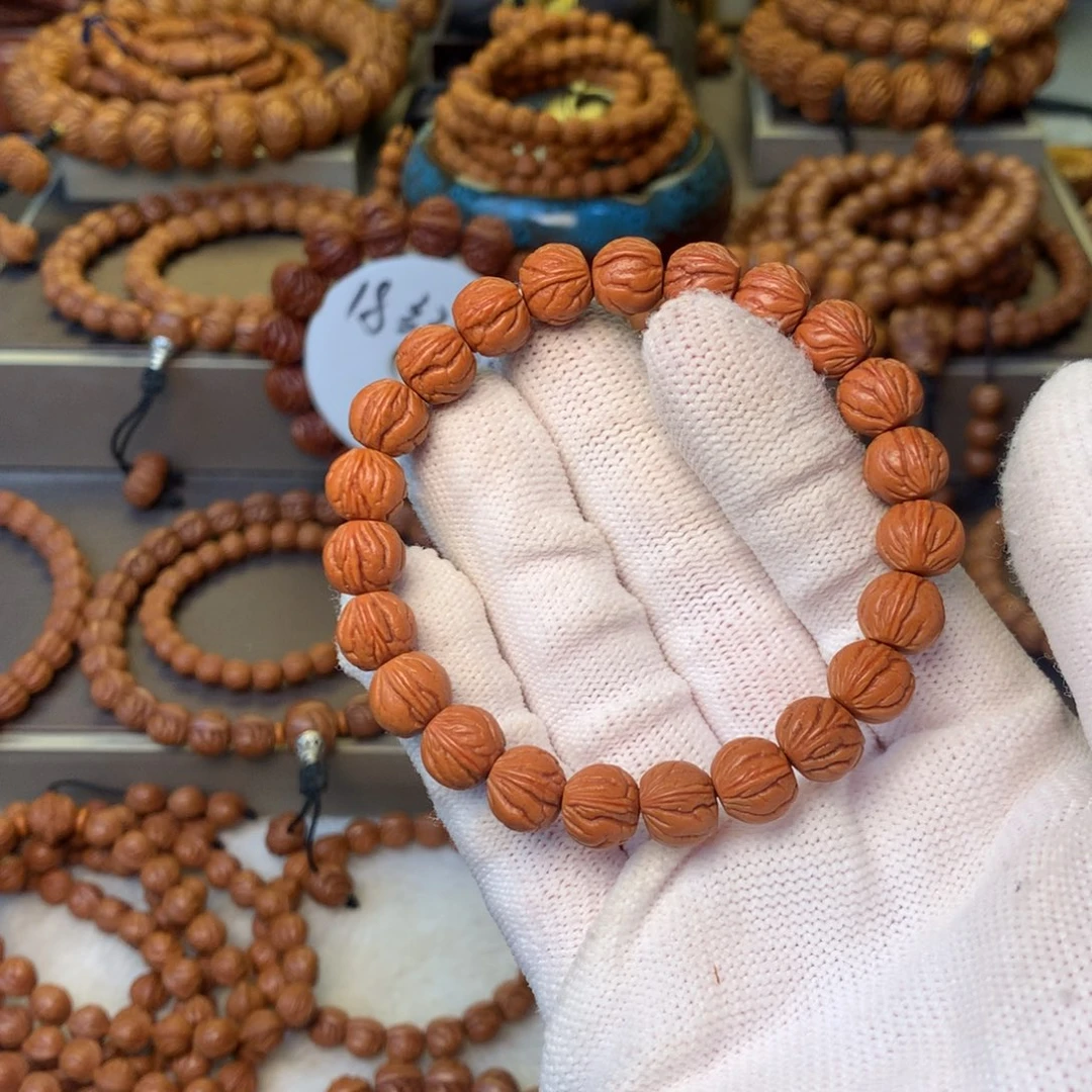 姜***人桃核手串秦岭龙纹