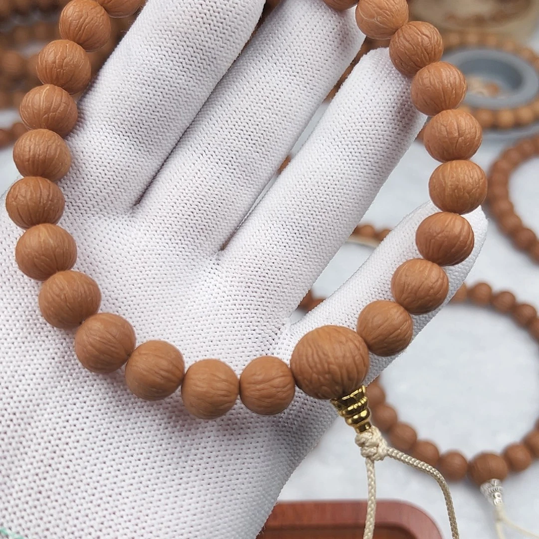 ༀ***ༀ猴头核桃手串凤羽