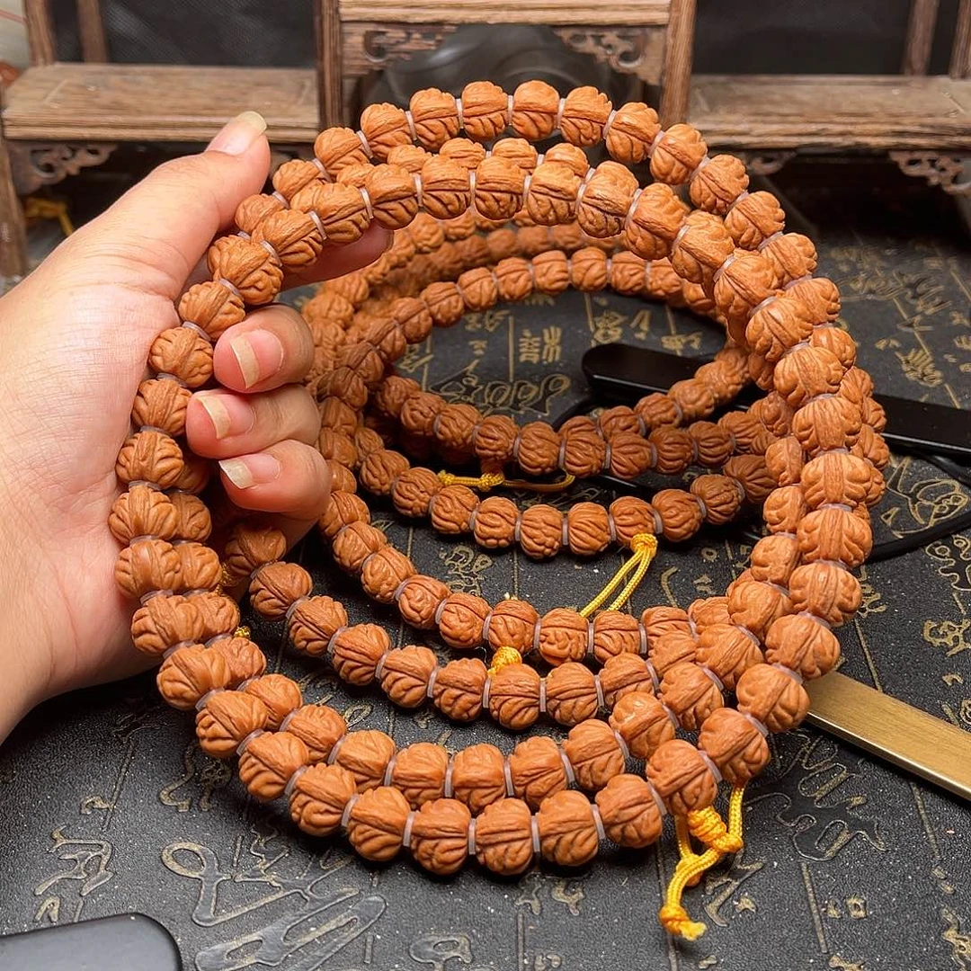 桃核吊坠赤金风雨手持