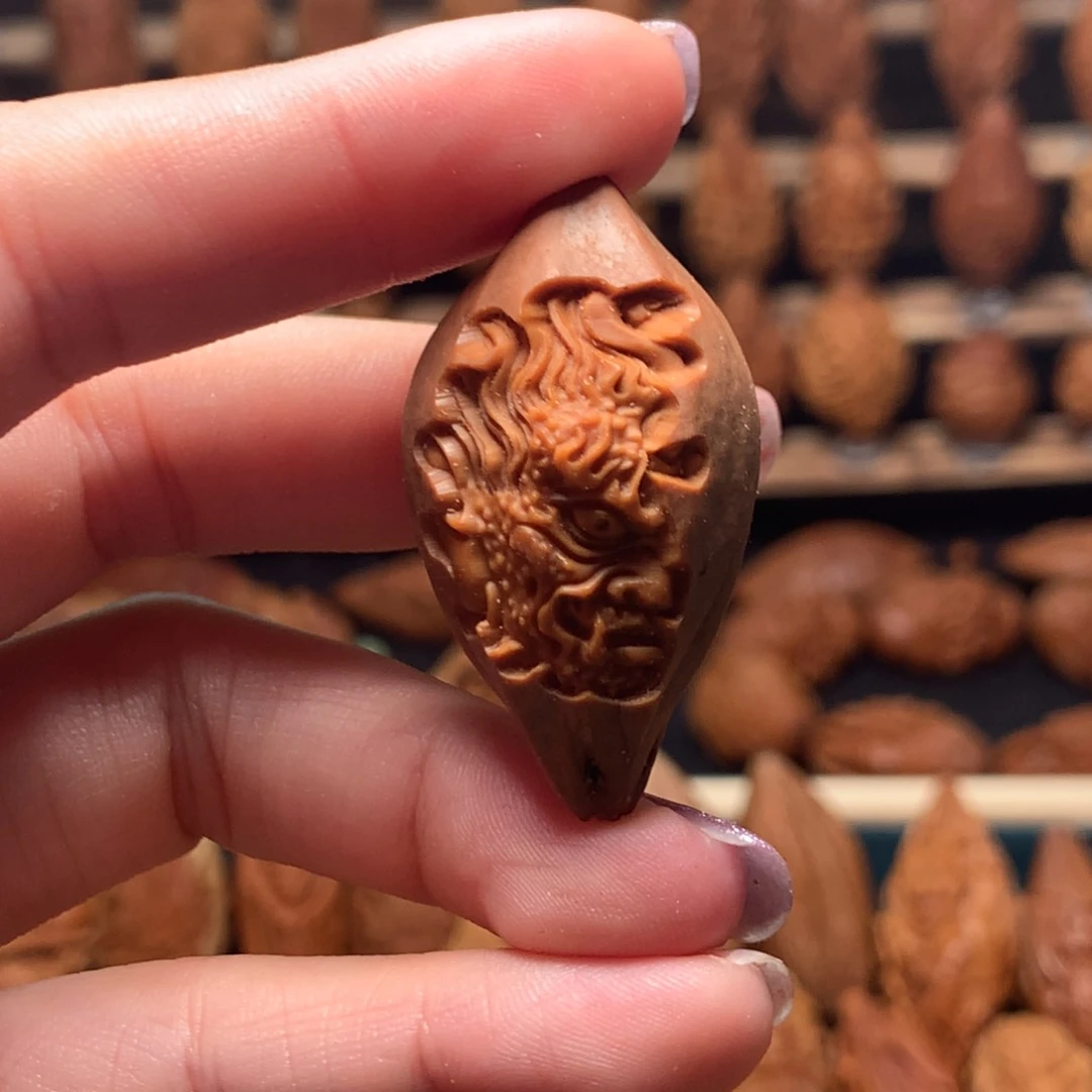把件橄榄核包衣一念