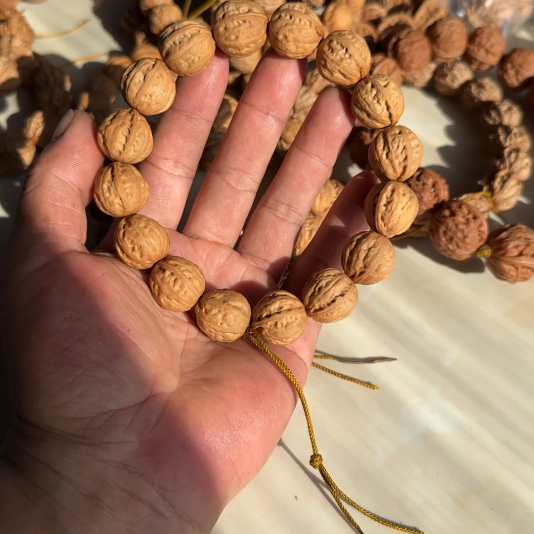 彭***圆文玩核桃吊坠小圆宝核桃