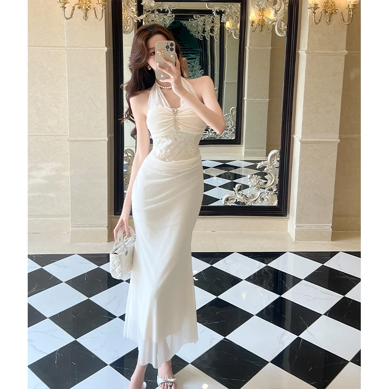 2025夏季新款纯欲风挂脖吊带连衣裙女设计感性感修身包臀网纱长裙