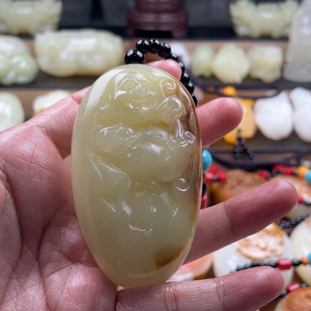 人***己石材古青石手把件