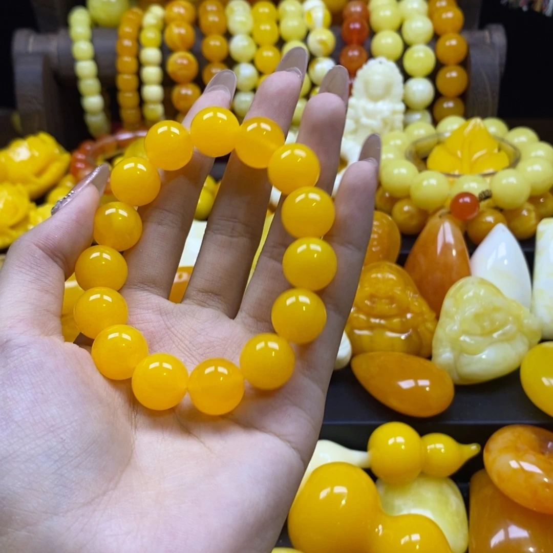 夕***阳树脂全品无暇鸡油黄手串