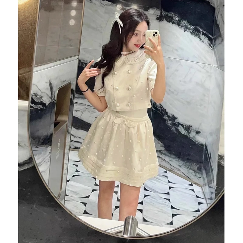 YOYOUNA法式甜美白色波点珍珠娃娃领珠光段短袖上衣+蓬蓬半裙套装