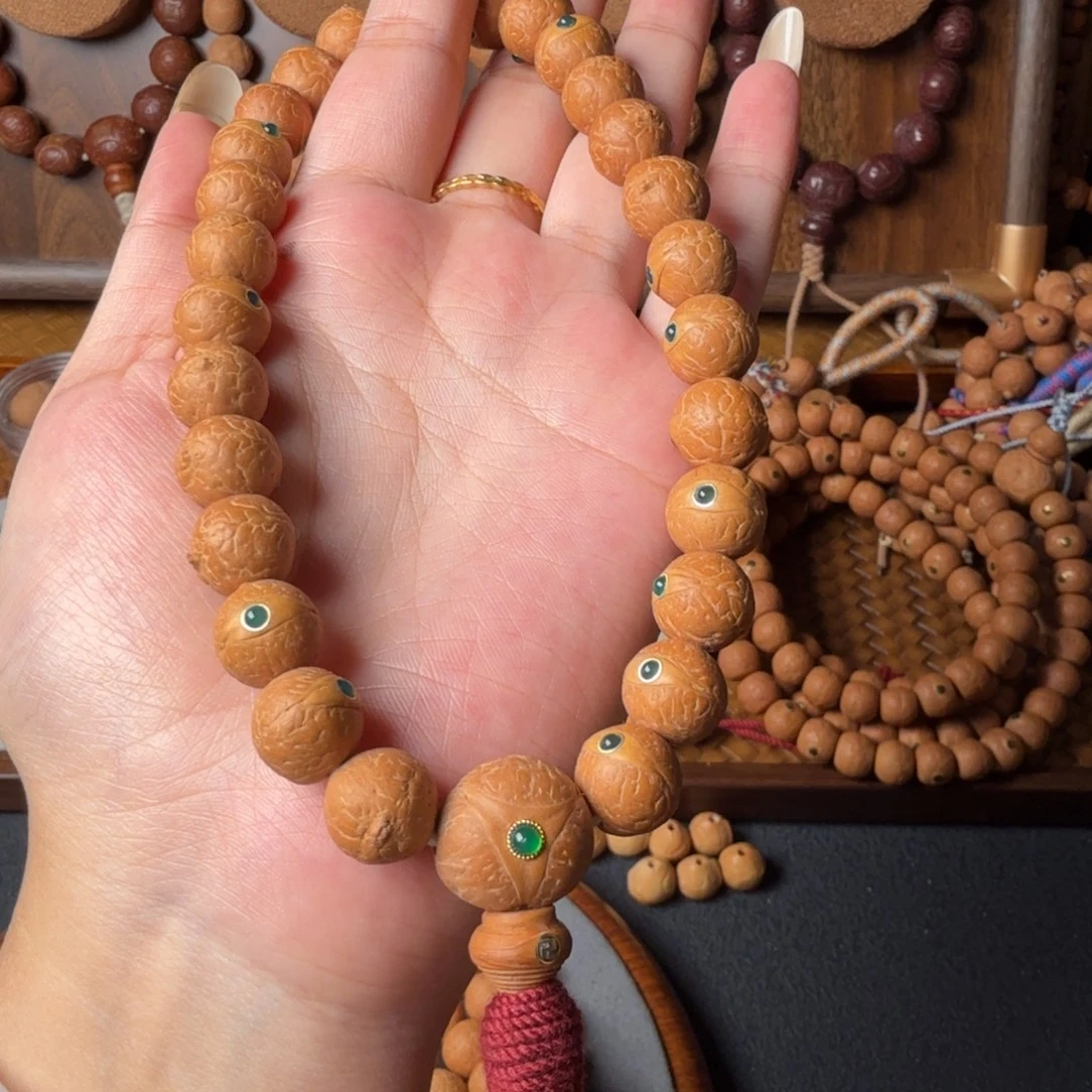 凤眼菩提把件12mm/27颗手持/镶嵌绿玛