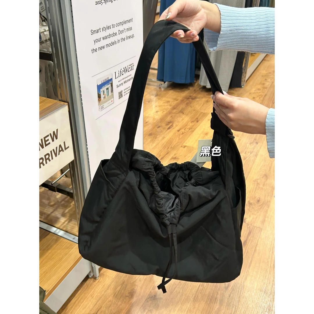 日系小众尼龙包女2025新款多口袋轻便通勤包大容量抽绳单肩斜挎包