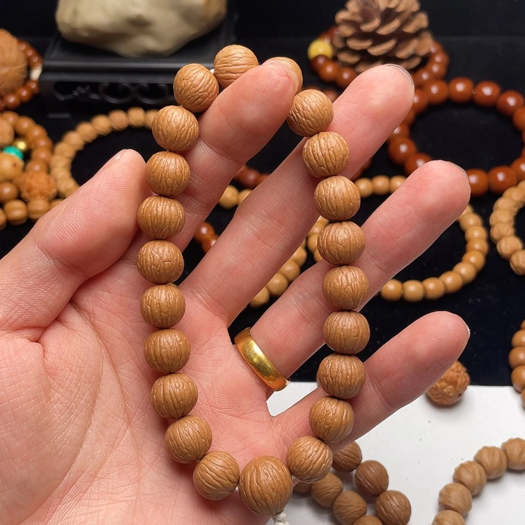 猴头核桃手串飞***?凤羽