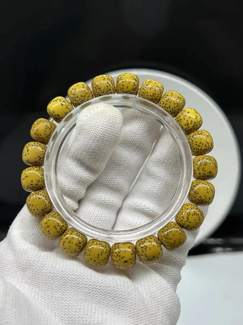 海南星月菩提福利精品原生态鸡油黄10X11正月桶珠双留白细星单圈