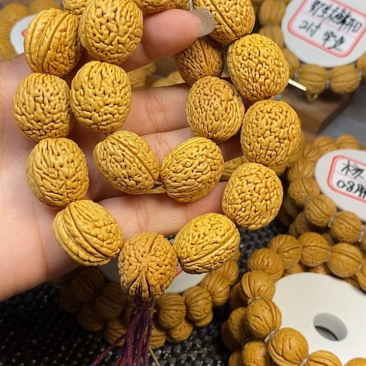 俯***牛桃核手串野生钱袋子2.0