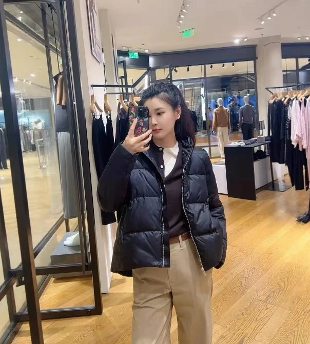 女士外贸黑色廓形前短后长A字型保暖舒适轻盈连帽拉链羽绒服